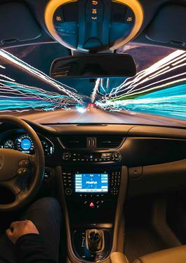 Person driving car at night