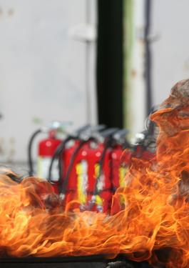 Firefighter Training Fire with Fire Extinguisher